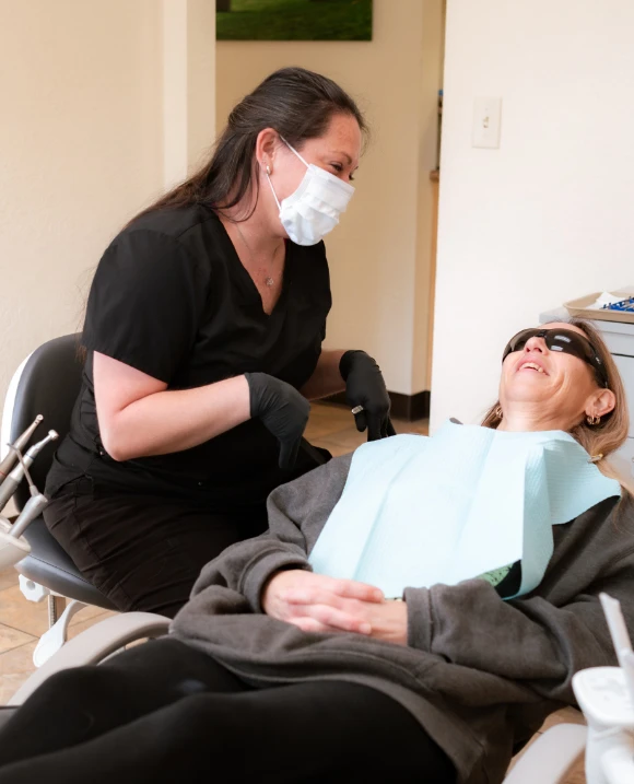 dental assistant with dental patient